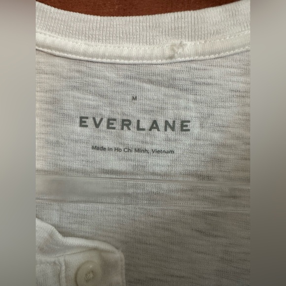 This piece features a slim fit, henley neckline organic cotton, - Picture 2 of 4